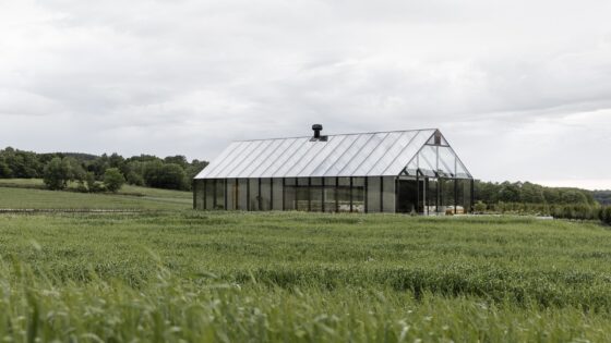 reflective exterior of restaurant in a field of grass