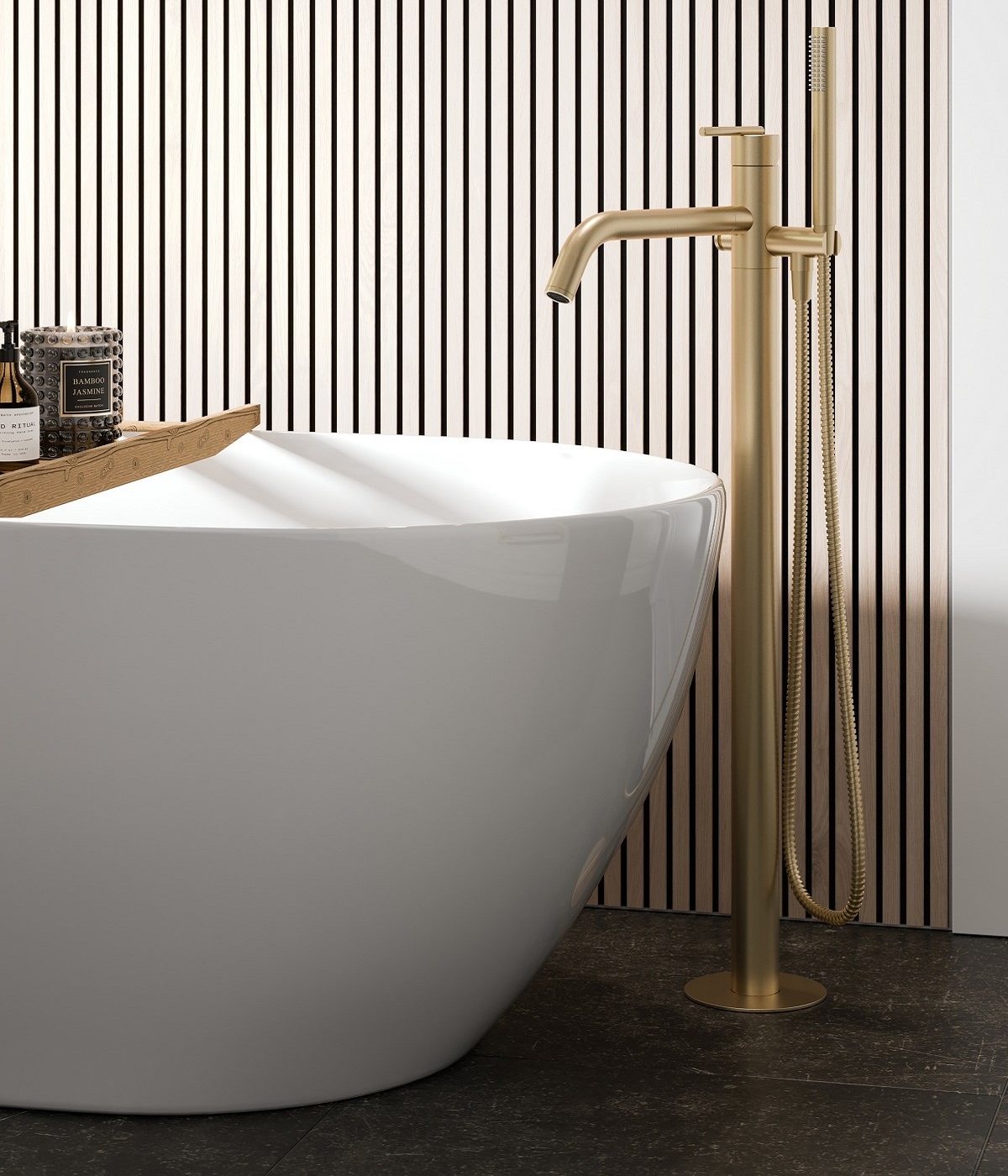 detail of corner of freestanding bath with brass pillar tap and wood panelled wall