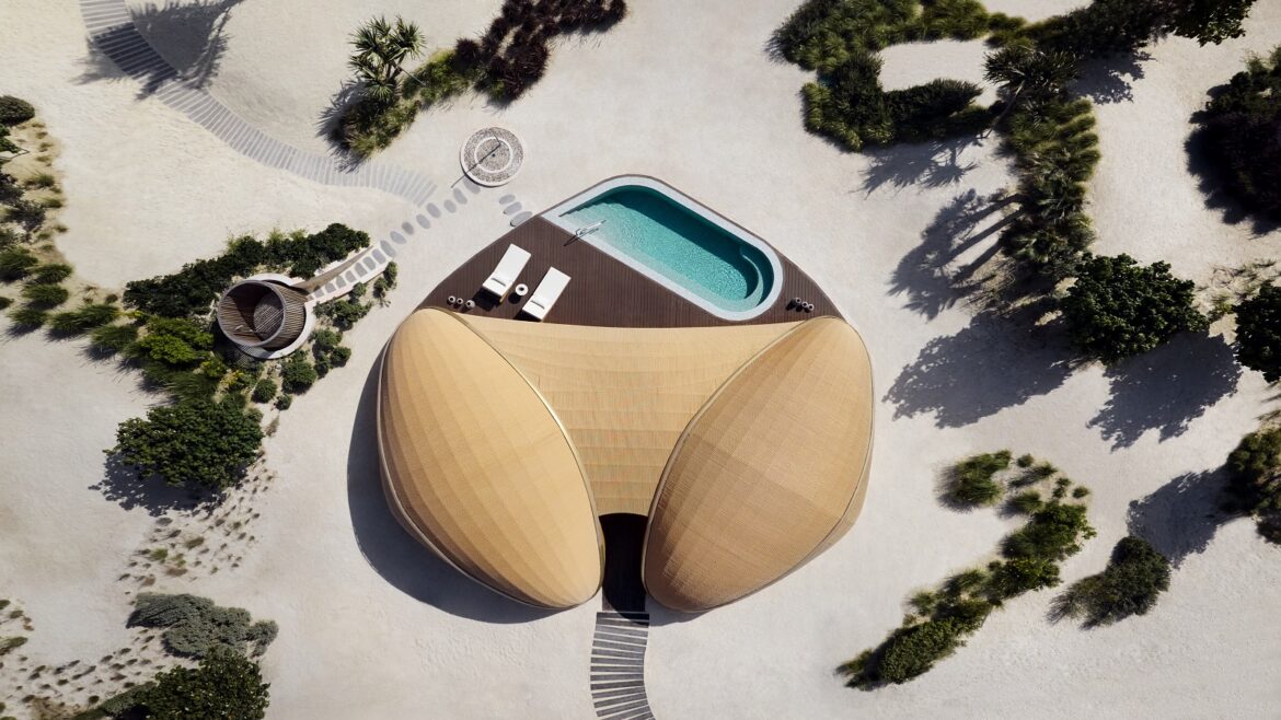 An aerial view of Nujuma Beach villa showing the building's curved roof and swimming pool