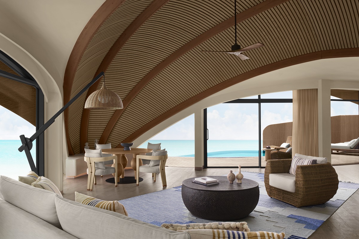 Inside one of Nujuma's overwater villas - sea views from the living room