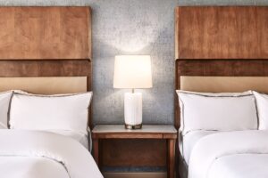 detail of beds with wood and stone surface details in Westin La Paloma