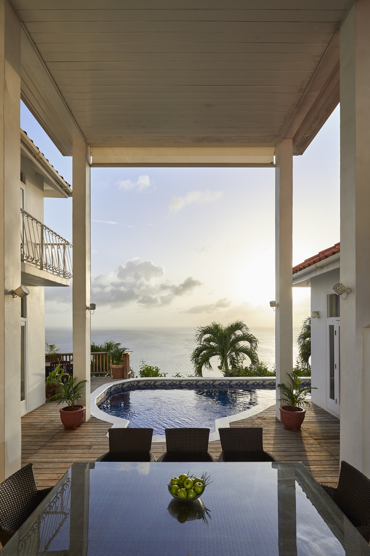 table overlooking pool, terrace and sea