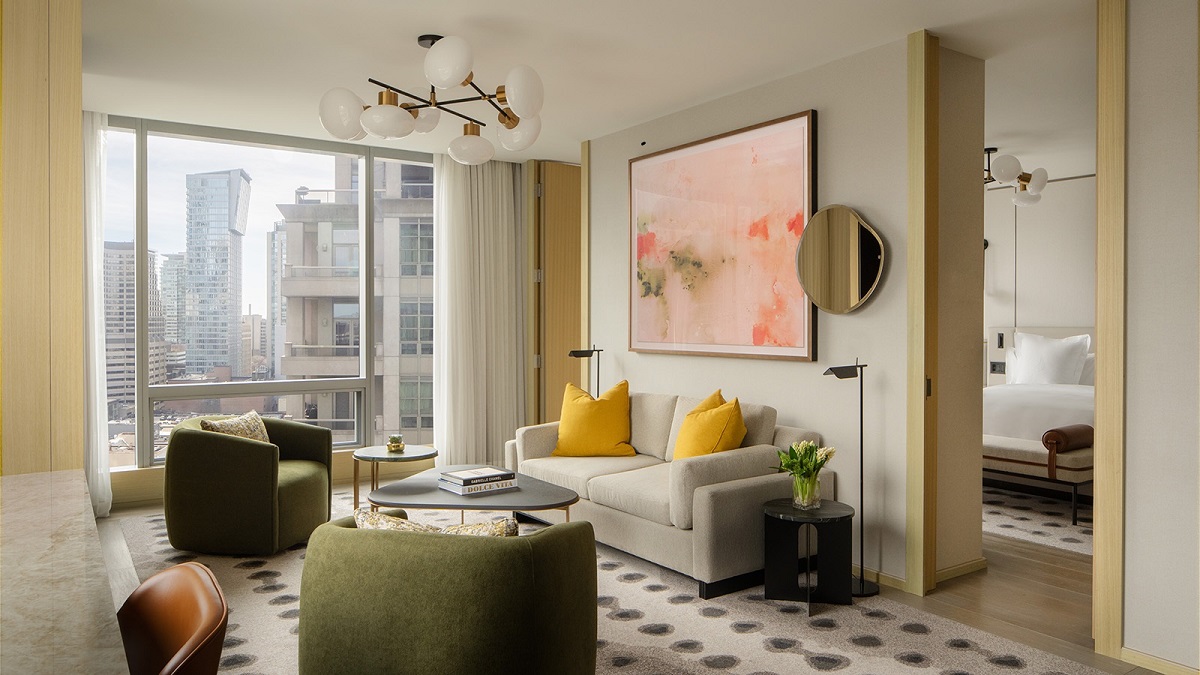 hotel suite in four Seasons toronto with neutral colours and pops of yellow