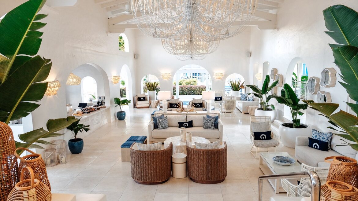 white on white interior lobby with wicker and plants in Windjammer Landing Villa Beach Resort