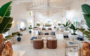 white on white interior lobby with wicker and plants in Windjammer Landing Villa Beach Resort