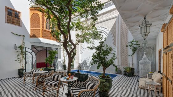 black and white tiled floor and striped cushions in Riad Botanica