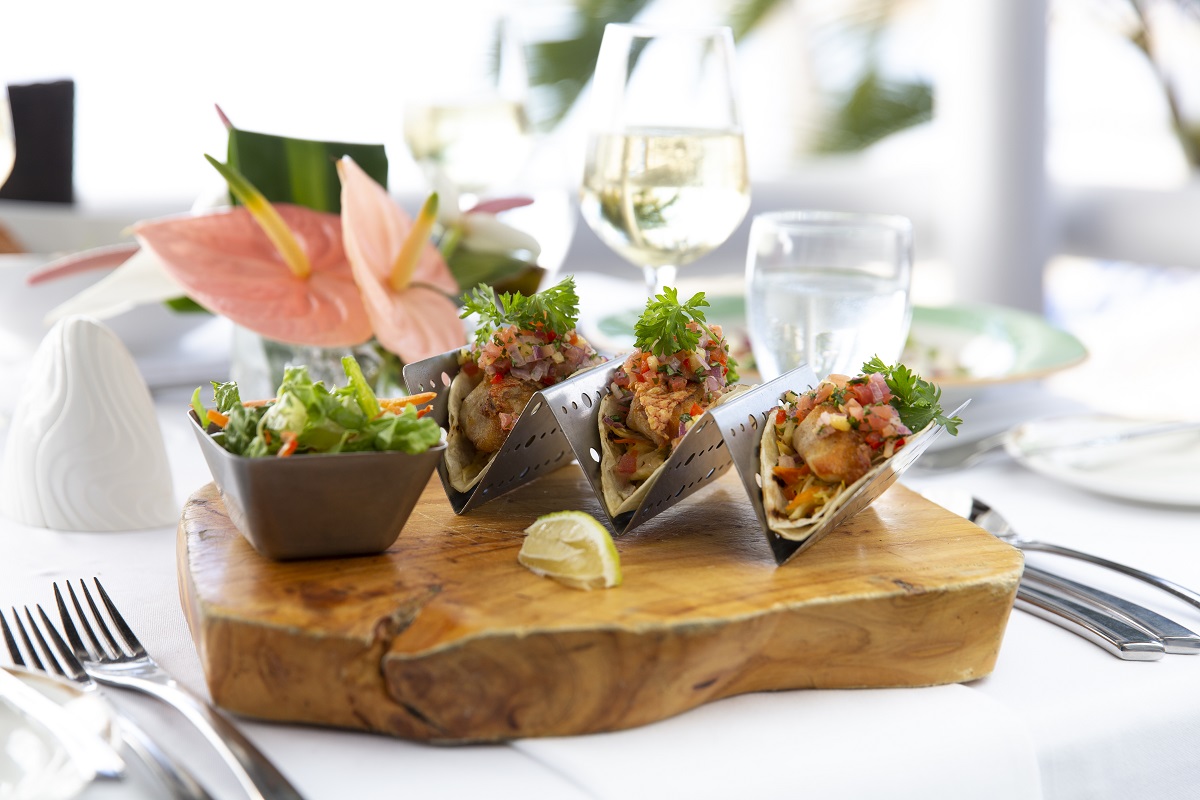 restaurant meal served on wooden board and white table linen