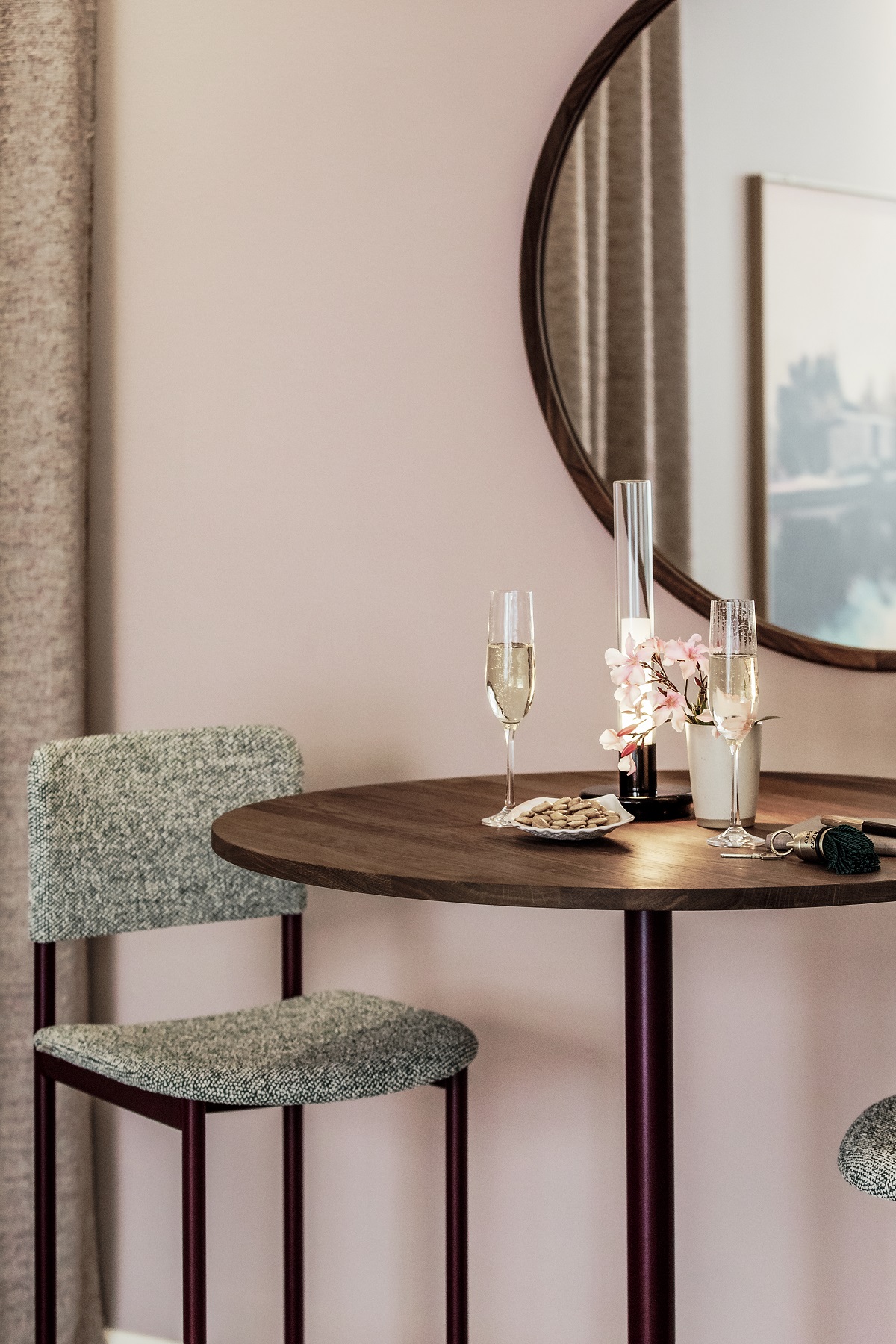 bistro table, chair and mirror in warm wood and pink