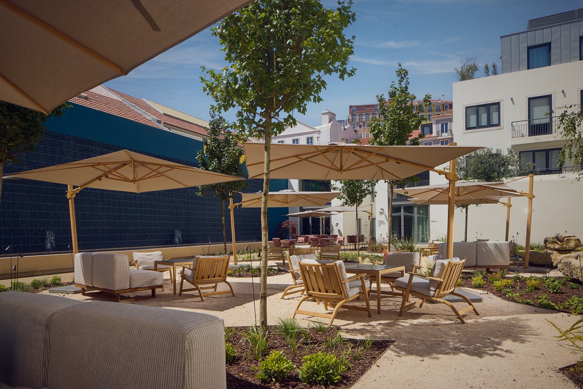 umbrellas and seating in outdoor terrace in DUO Hotel Lisbon