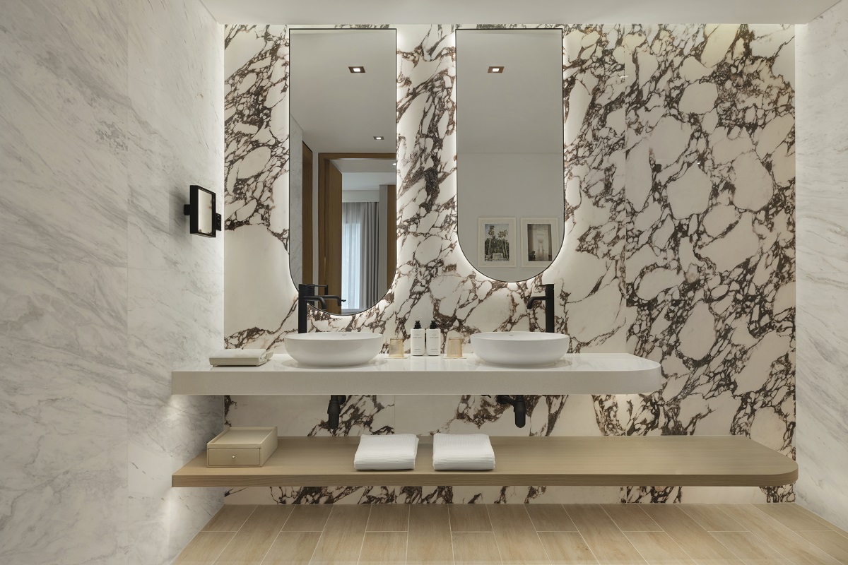 white bathroom design with dramatic black and white marble wall in Delano dubai