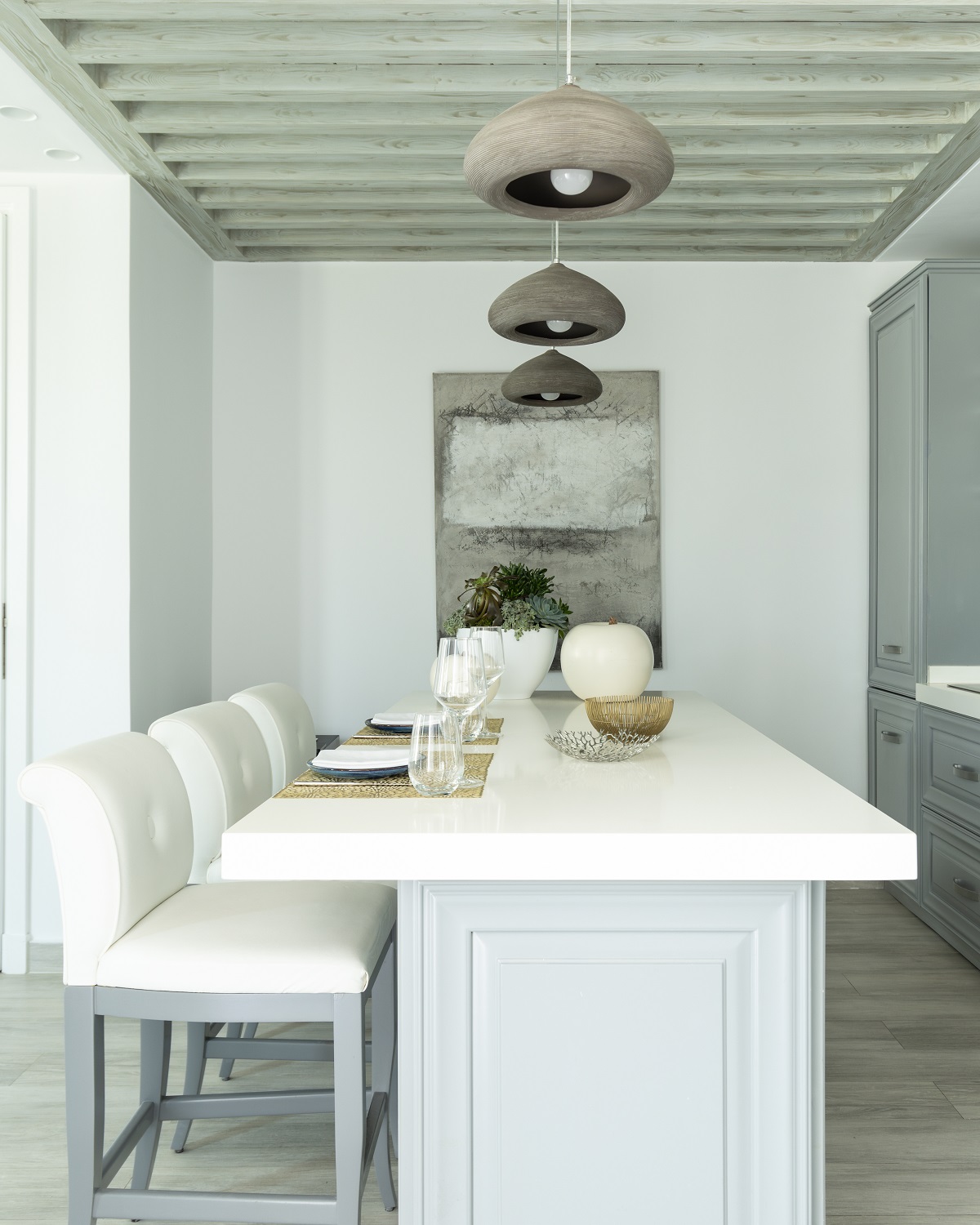 grey and white minimalist dining area in Nammos villa