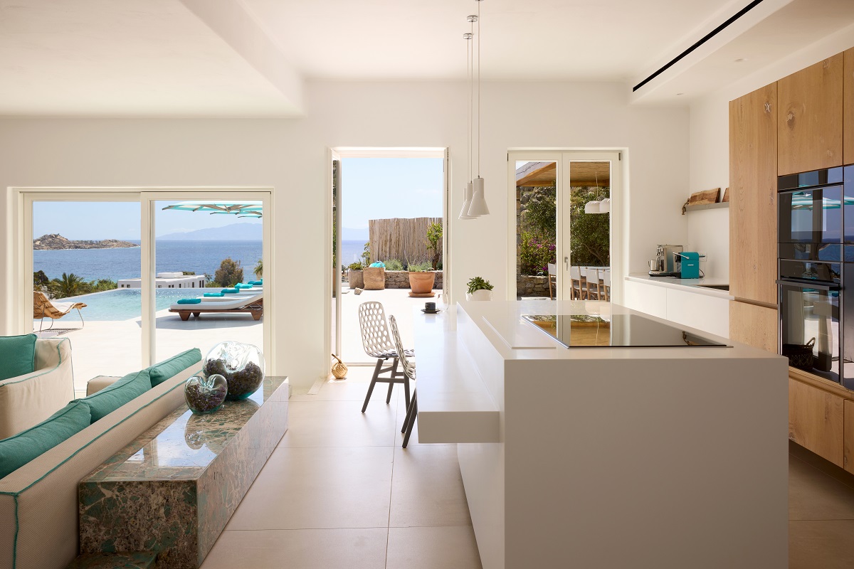 open plan kitchen and lounge leading on to terrace in the Infinity Villa Nammos
