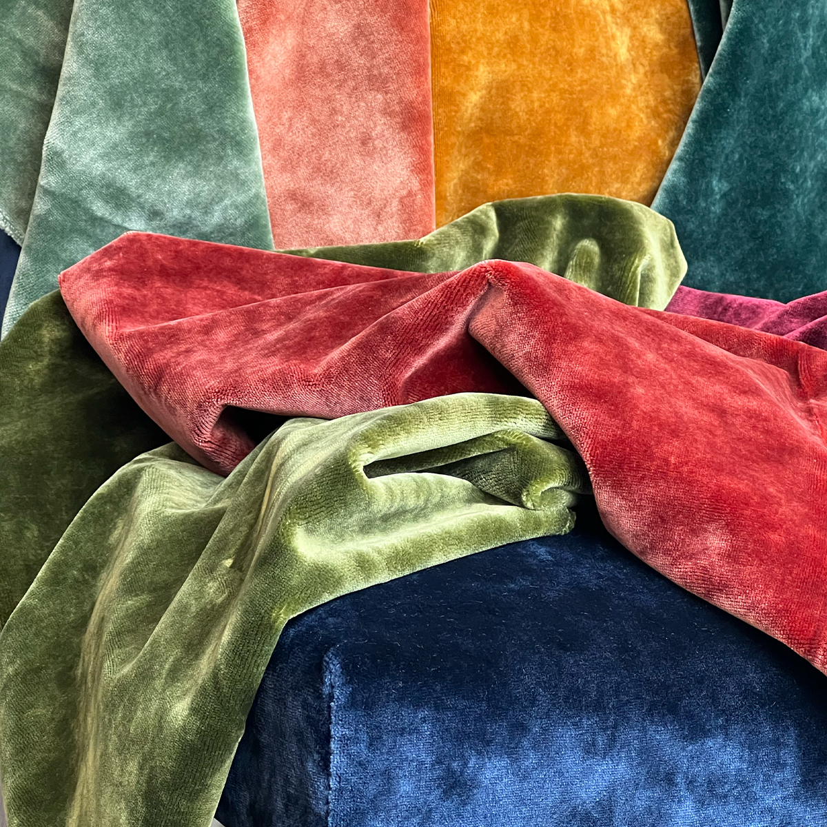 collection of velvet colour samples draped and folded 