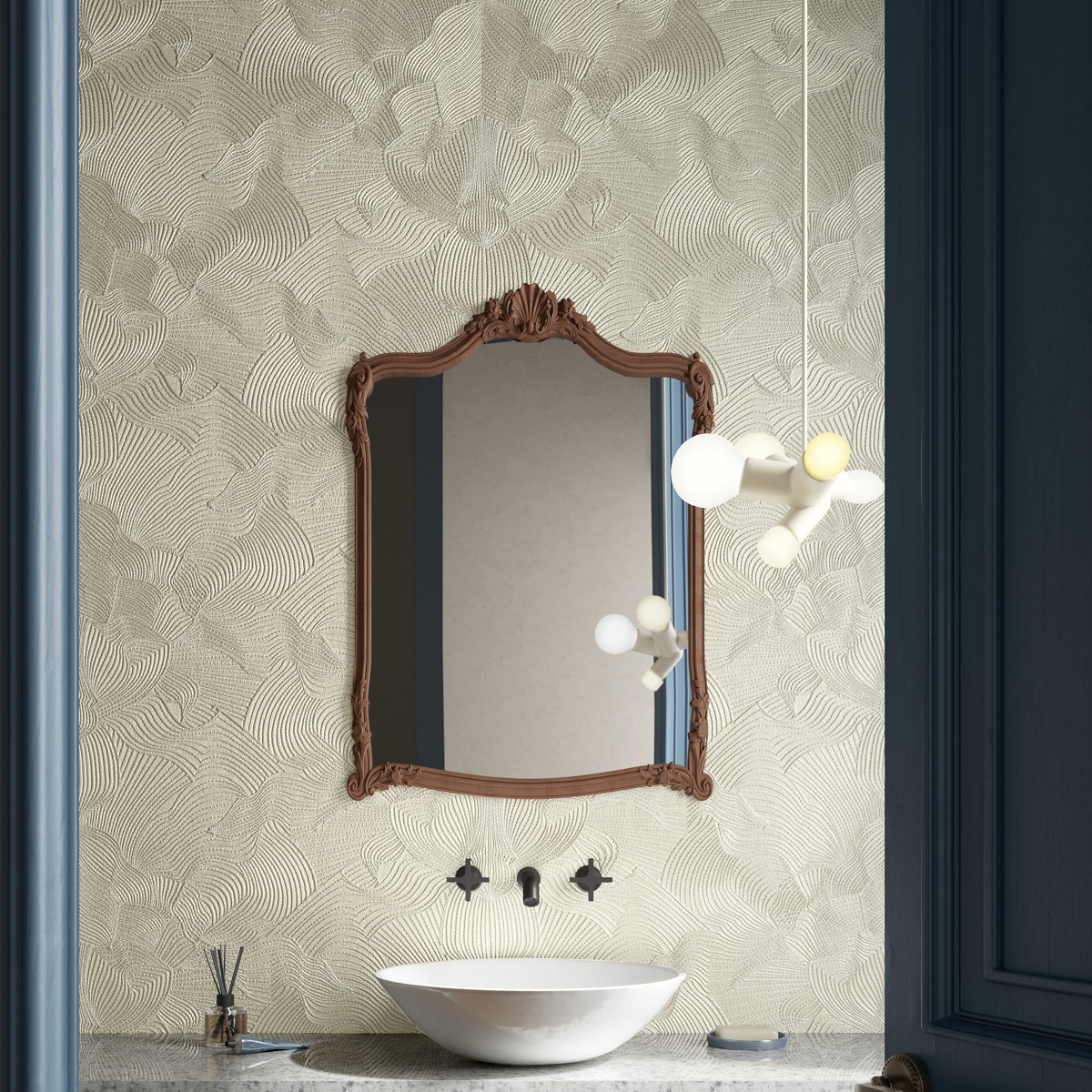 swirled wallpaper pattern behind vanity and mirror
