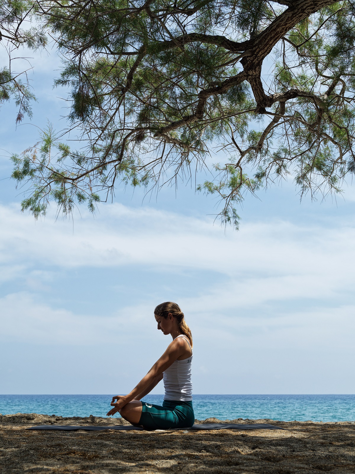 woman meditating on Greek island