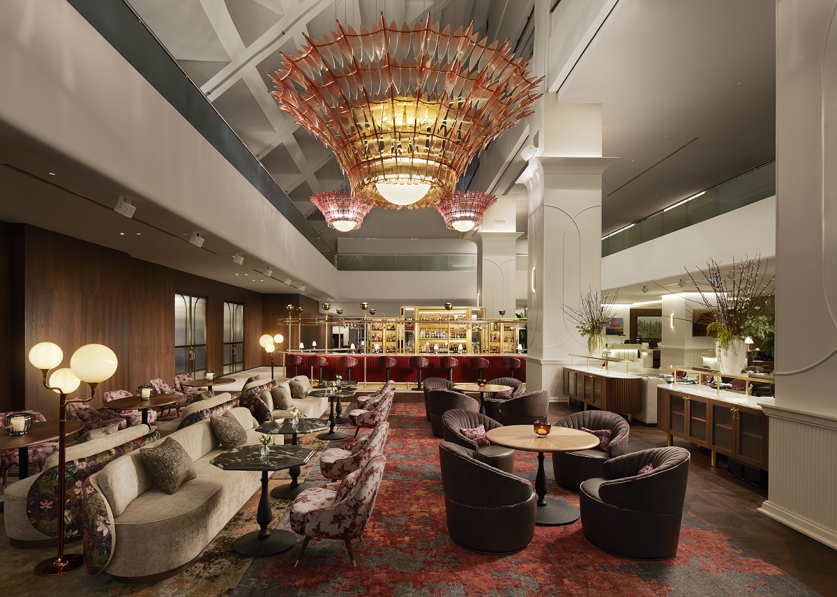 comfortable low seating and tables leading onto bar area in Hilton Toronto lobby