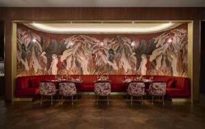 Arte wallcovering in statement wall behind banquette seating in hilton lobby