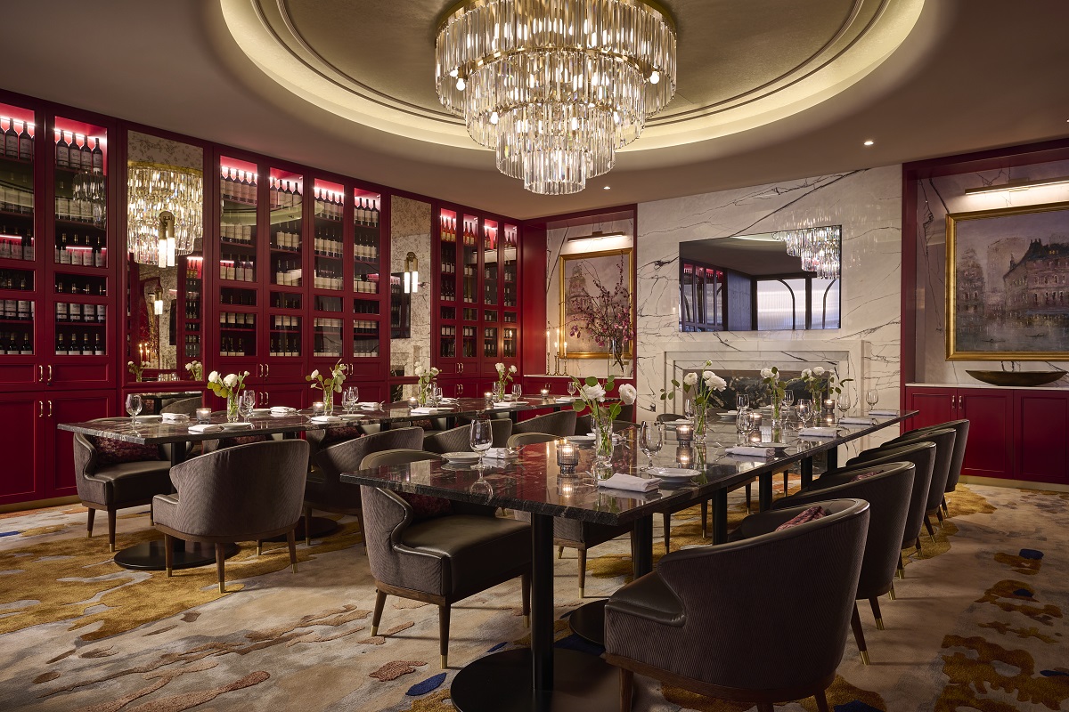 central chandelier and architectural lighting above dining tables in Frenchy Toronto