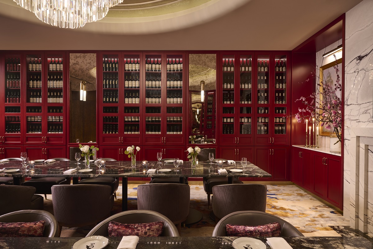 red lacquered wine storage shelving along the wall in Frenchy Toronto