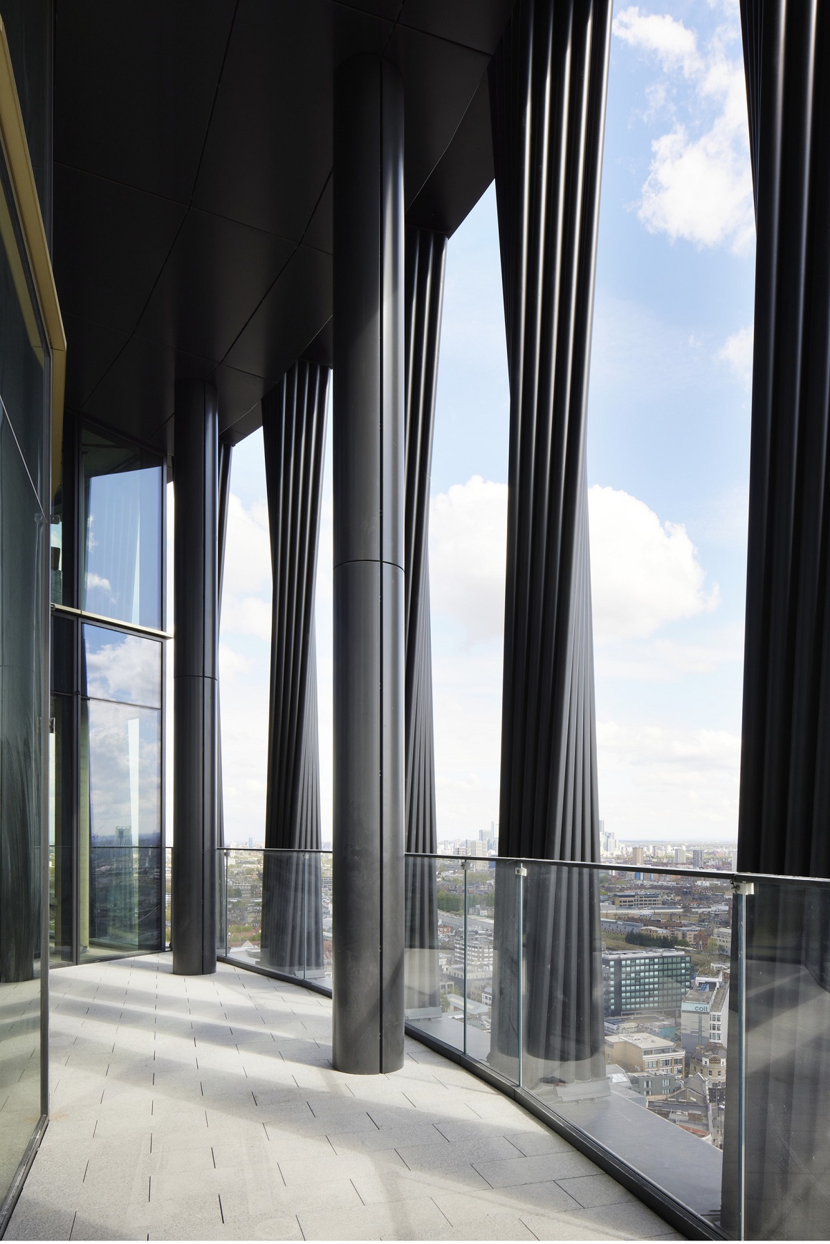 curved passage and interior detail of structure and façade of art’otel London Hoxton by Squire & Partners