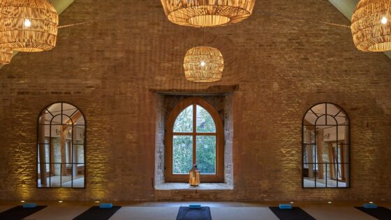 exposed brick, natural woven lampshades and period window features in grain store renovation by sparcstudio
