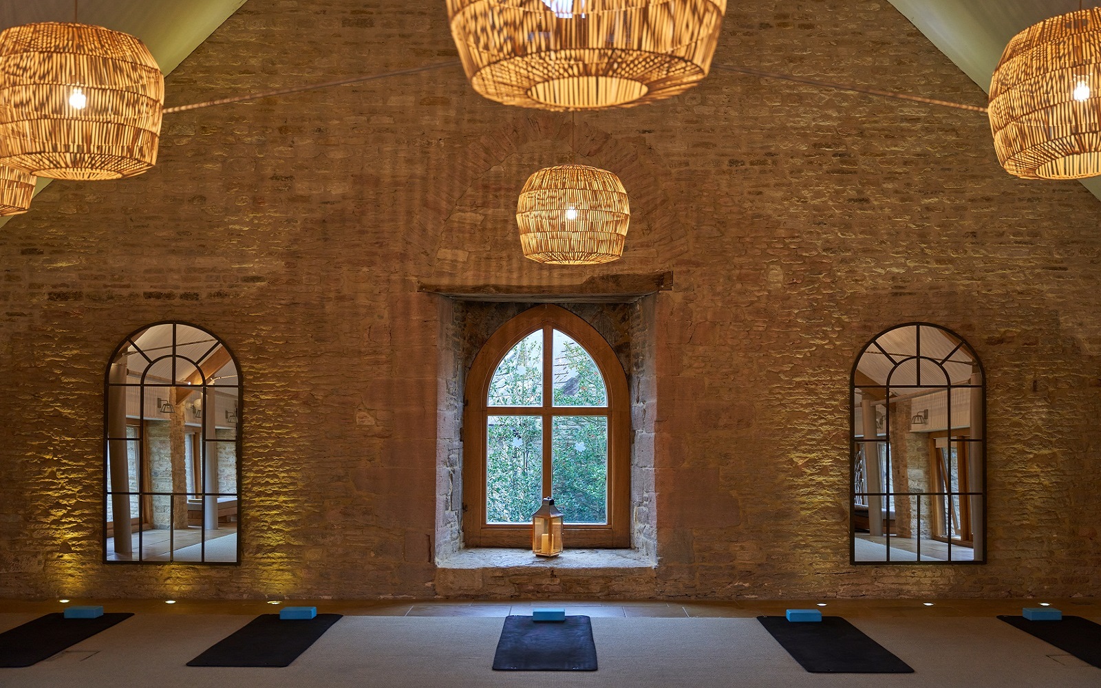 exposed brick, natural woven lampshades and period window features in grain store renovation by sparcstudio