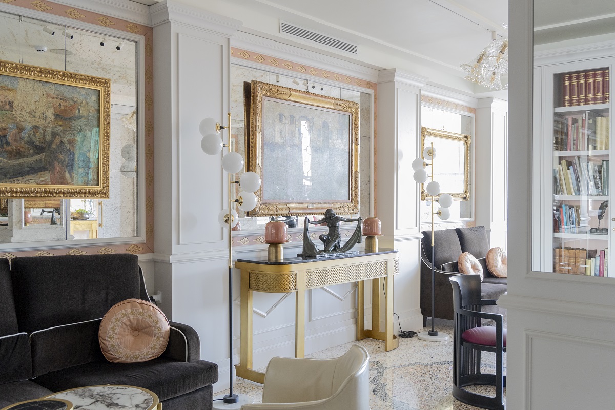 salon area in hotel with traditional gilt and marble elements