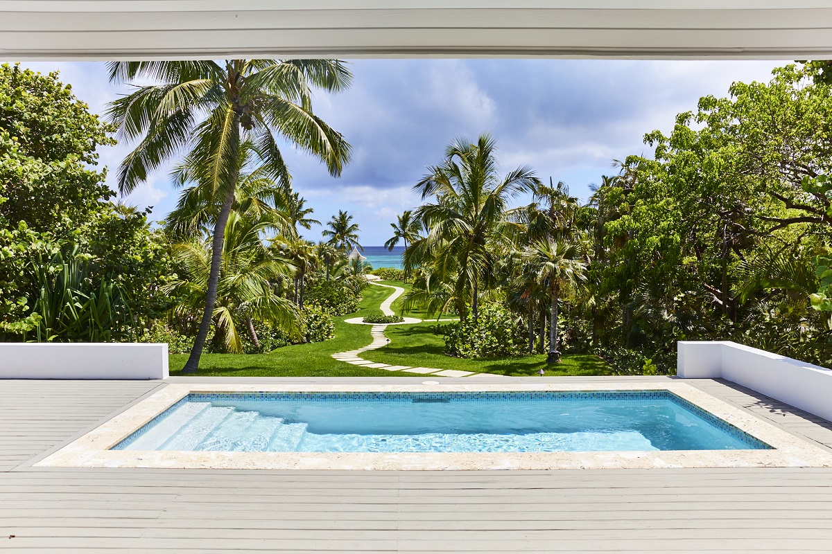 private terrace and pool overlooking caribbean island garden