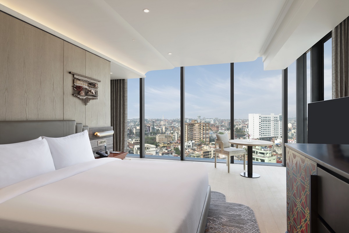 guestroom with view over Kathmandu with floor to ceiling windows