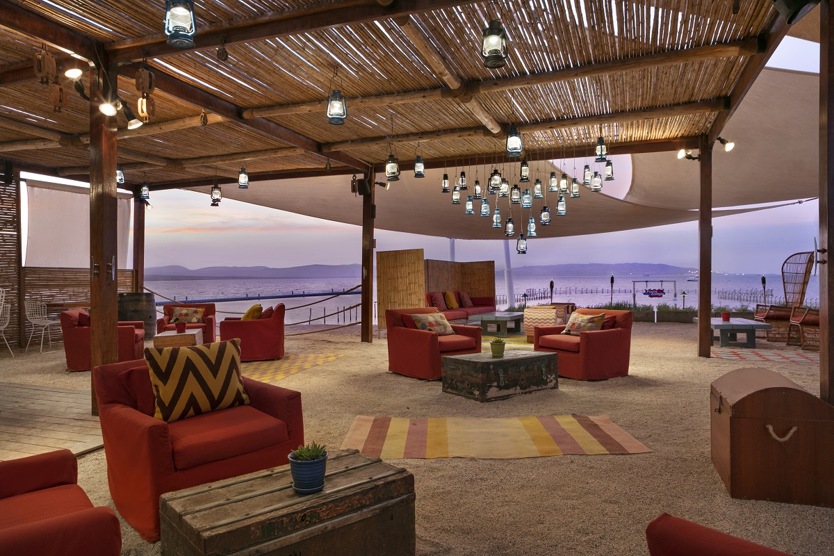 comfortable seating in outdoor restaurant space under bamboo ceiling