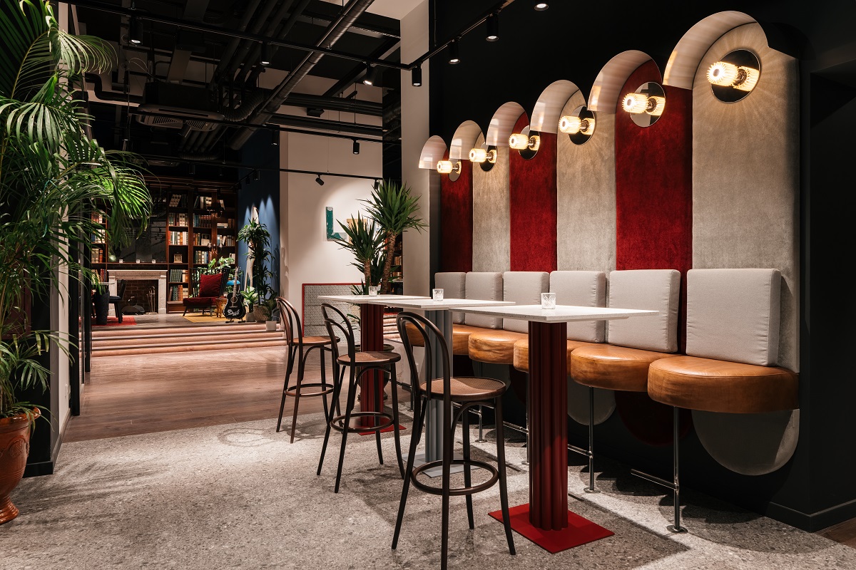 arched alcoves above banquette seating in red and beige