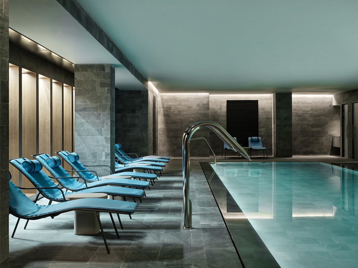 reclining loungers next to indoor pool in spa at hotel intercontinental crete