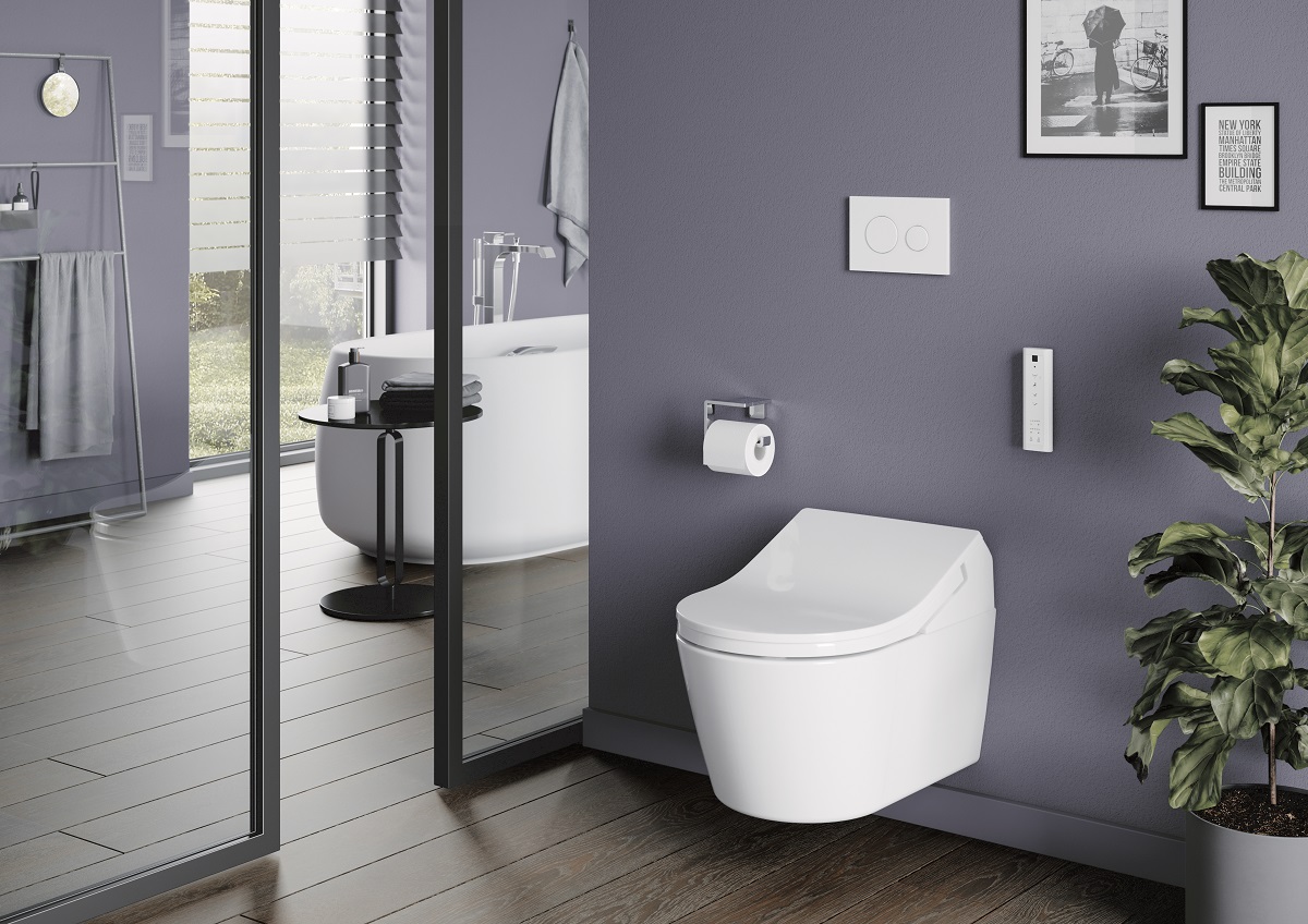 hotel bathroom with white wall hung TOTO toilet on a grey wall