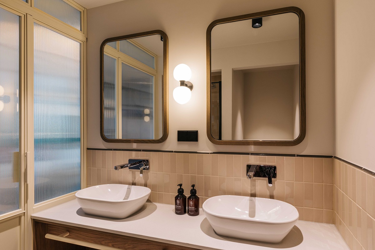 double basin and double mirrors in compact hotel bathroom design