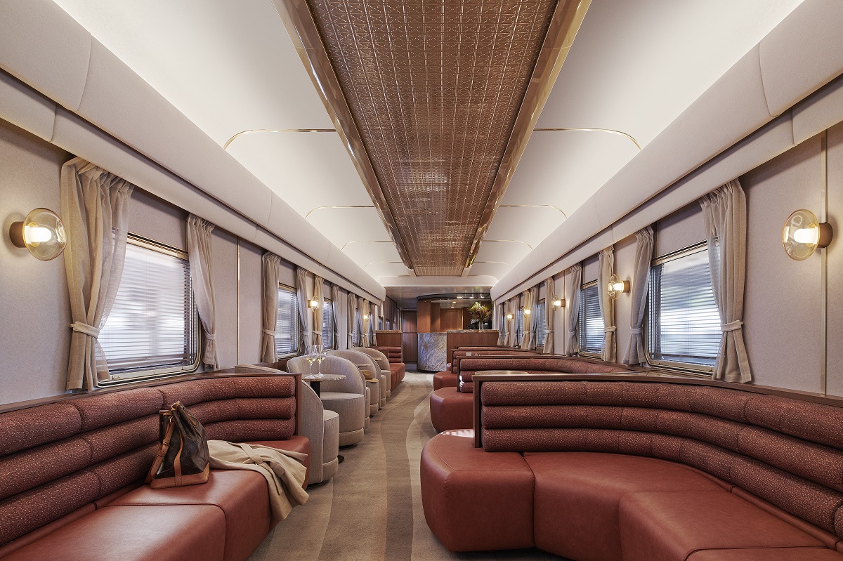 curved leather banquettes in the train with striped modieus carpet