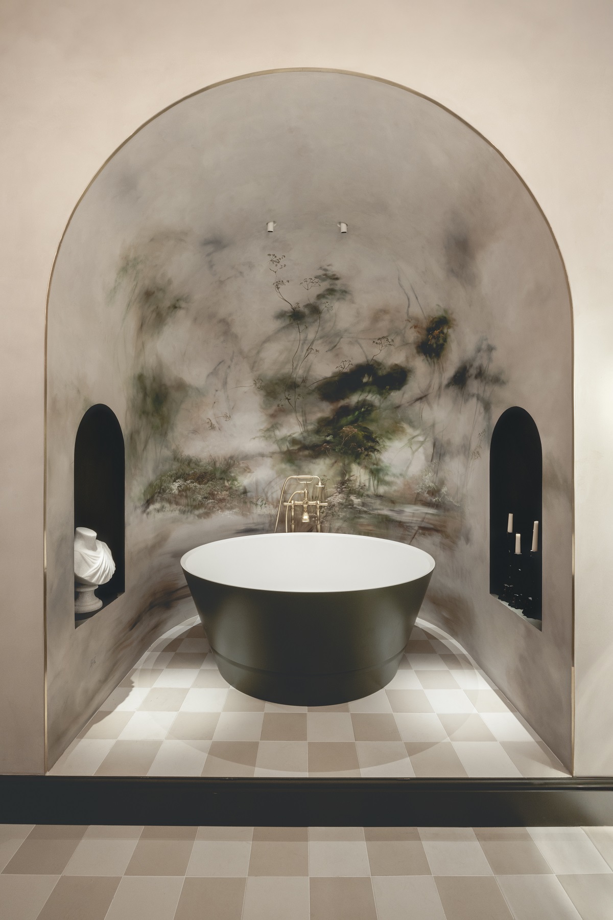 freestanding round bath in arched niche with handpainted walls