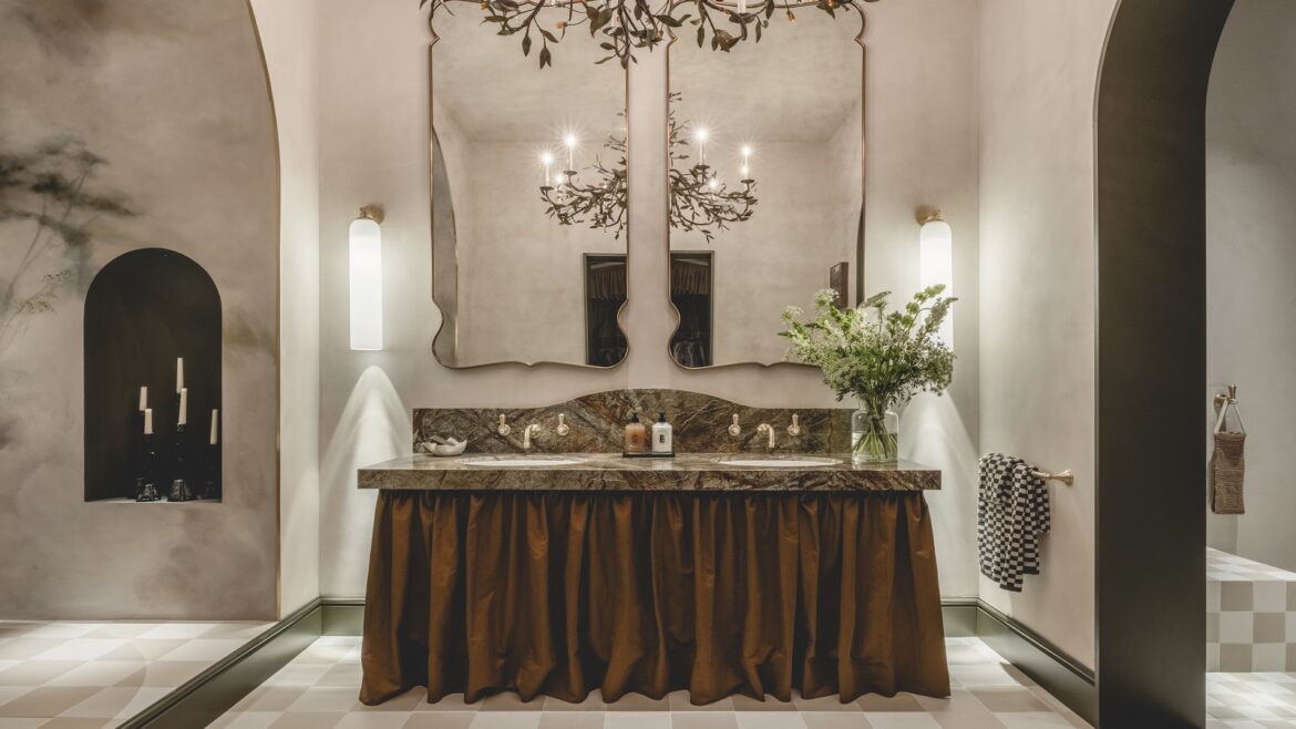 double vanity with double mirror and organic chandelier with brass leaves in the WOW!house bathroom design