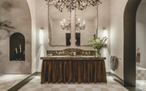 double vanity with double mirror and organic chandelier with brass leaves in the WOW!house bathroom design