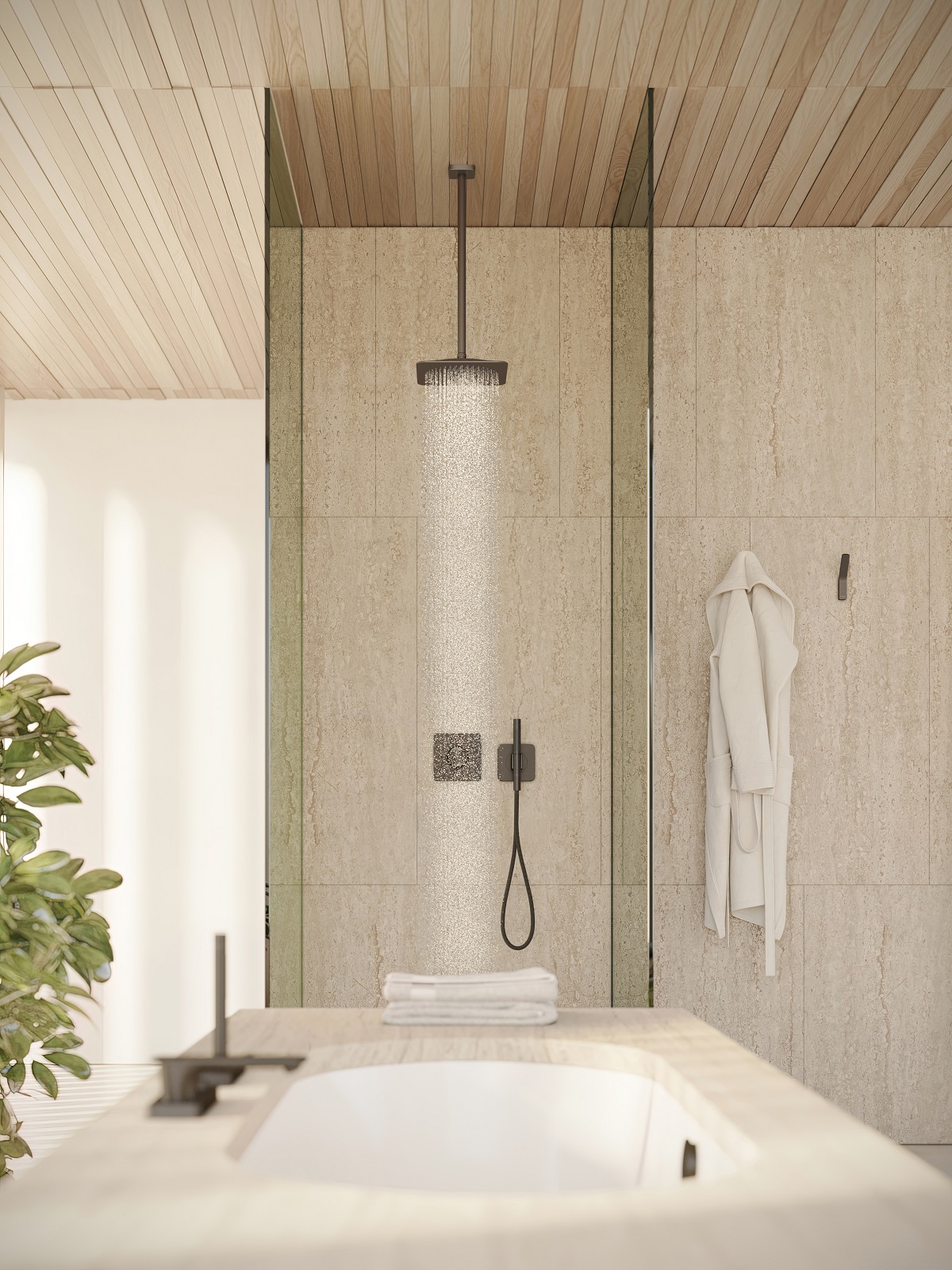 shower cubicle with glass side and centred shower with bath in foreground