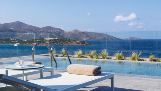 white sunloungers with private pool in front all overlooking Mirabella bay Crete
