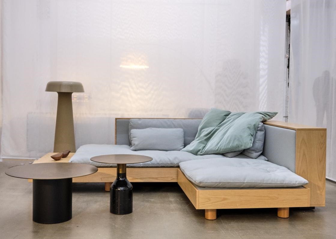 noka couch with wooden frame and loose cushions from Ligne Roset contract