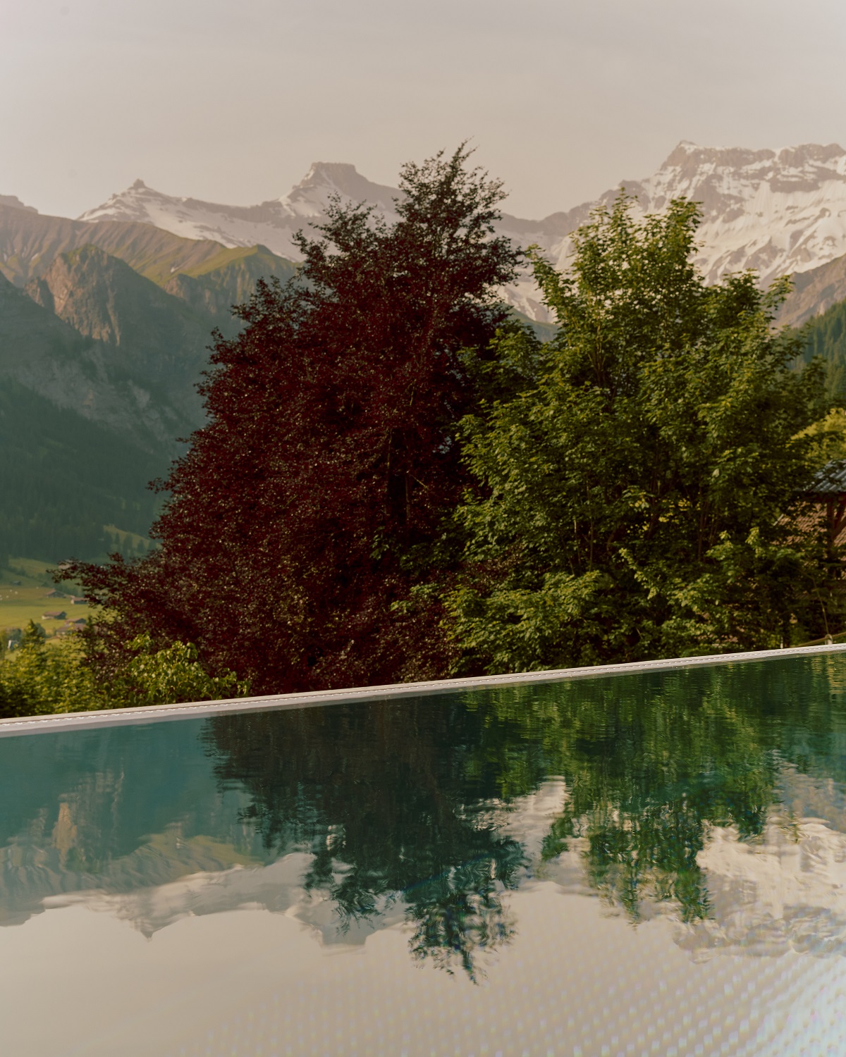 swimming pool with view over swiss alps