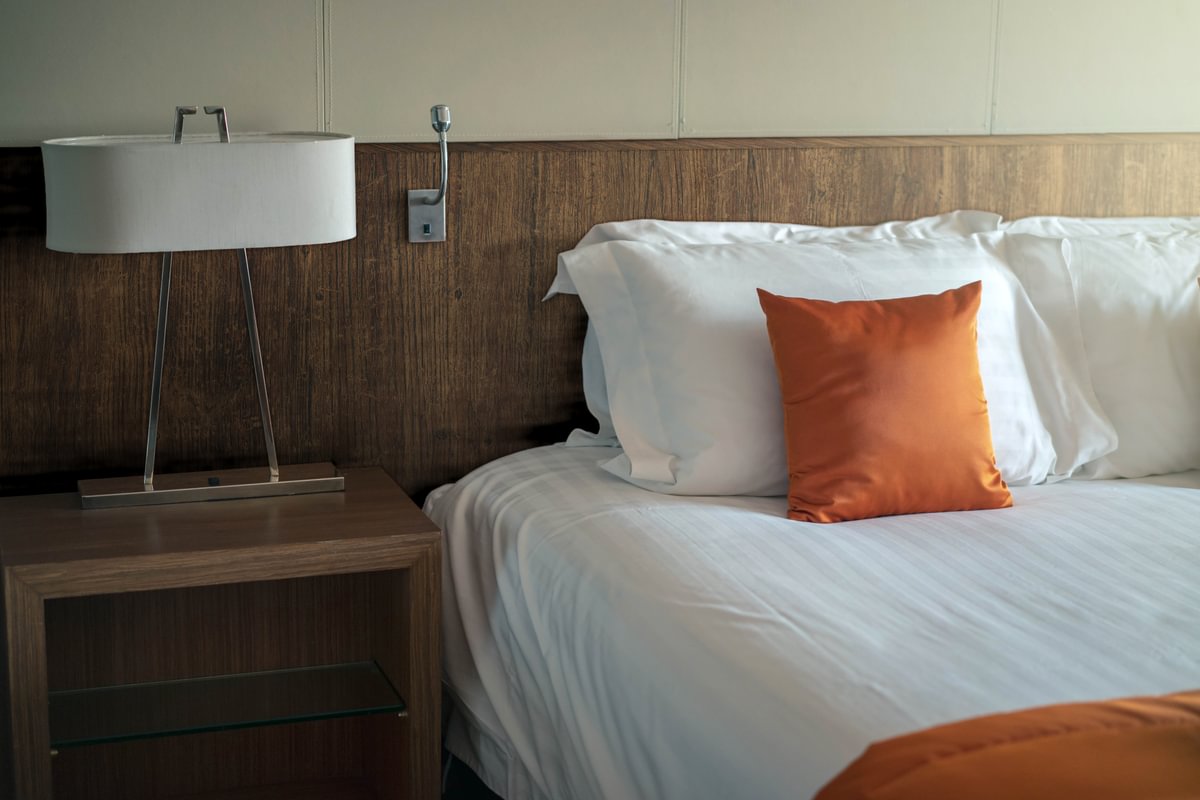 bedhead clad in film in hotel guestroom