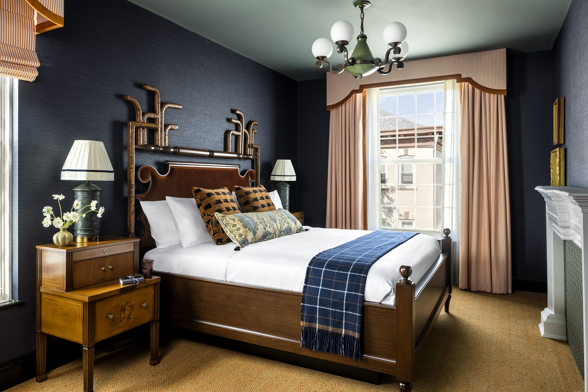 Graduate Princeton guestroom with wood and dark blue details