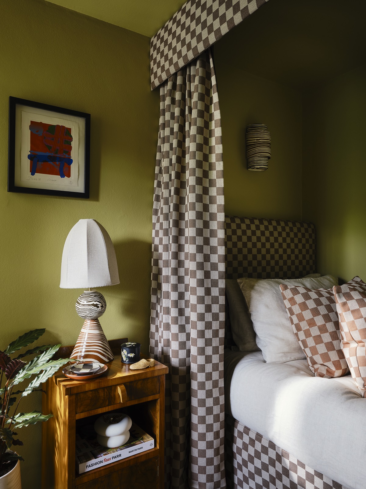 bedroom dressed with Harlequin x Henry Holland brown check curtain around the bed