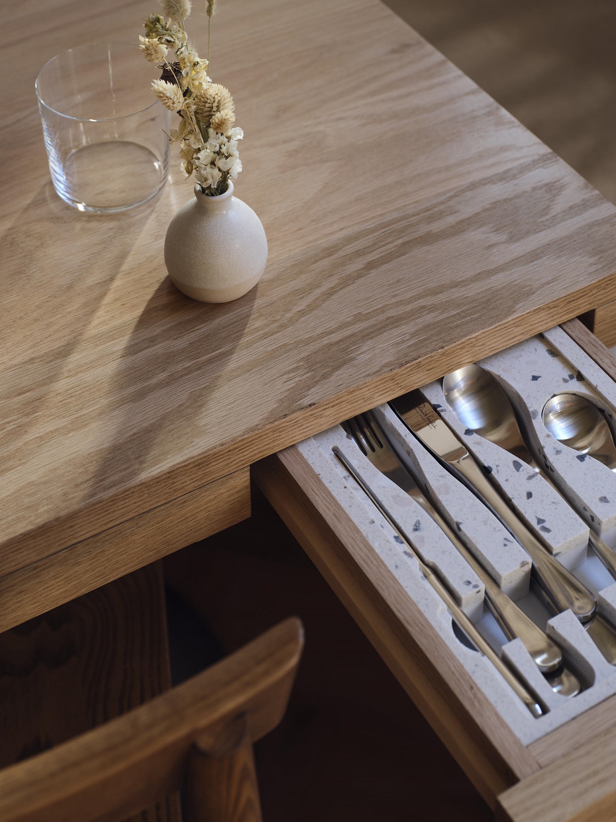 terrazzo and wood drawer for diners cutlery in restaurant table