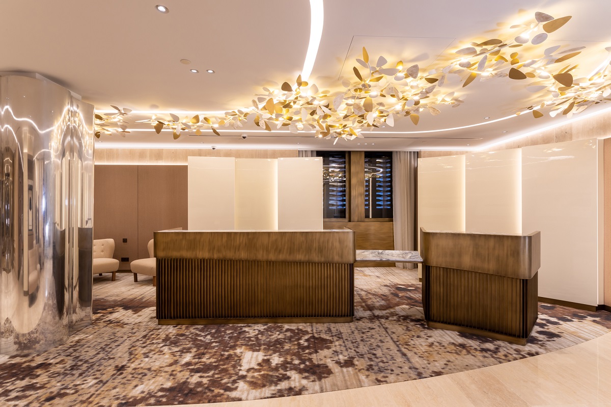 reception with bespoke lighting above and bespoke ege carpet on the floor