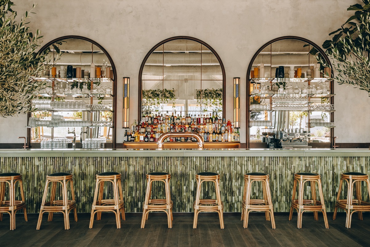 bar stools lined up in front of Le Perchoir bar