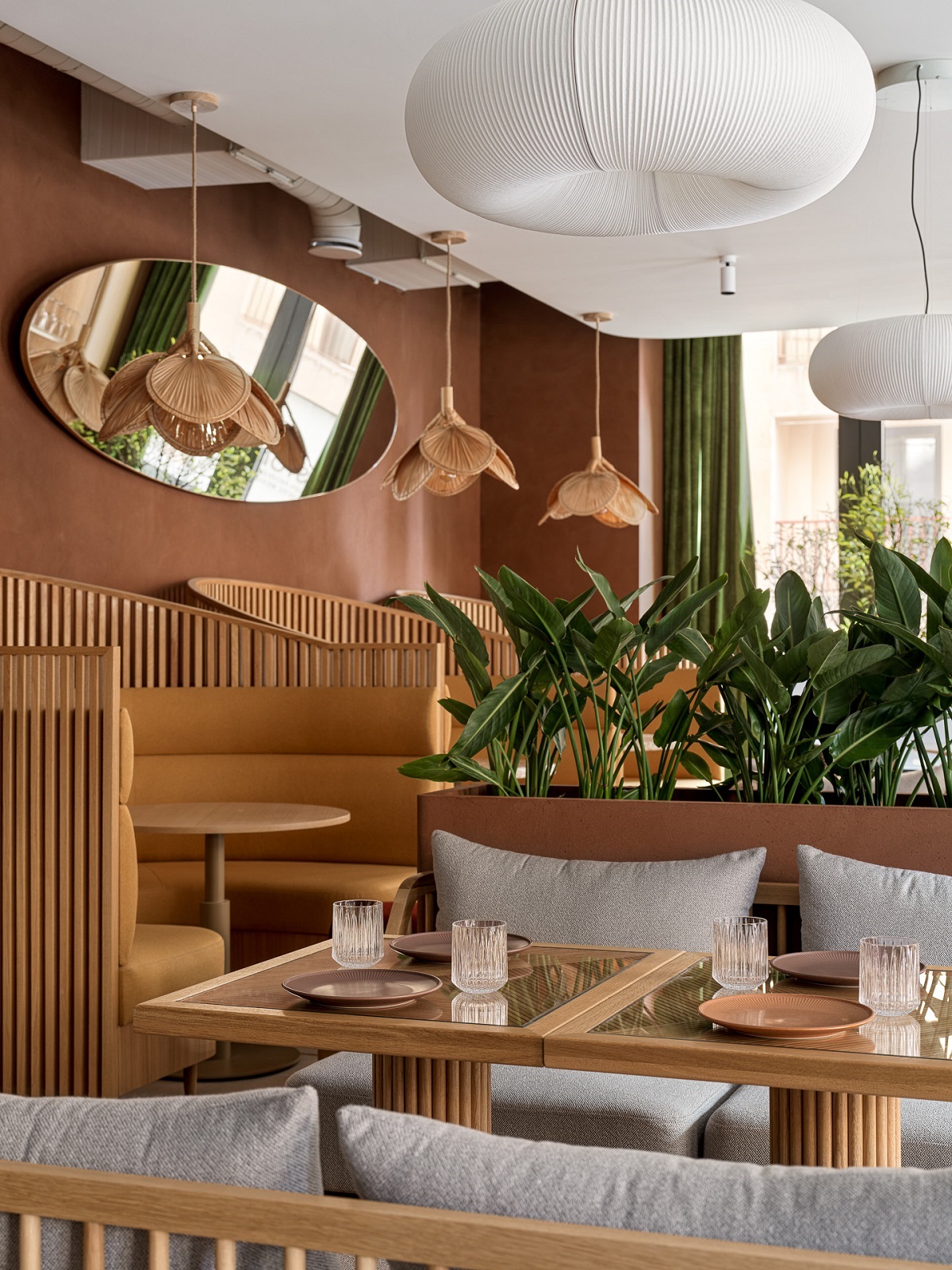 terracotta walls and light wood furniture in studio shoo designed restaurant