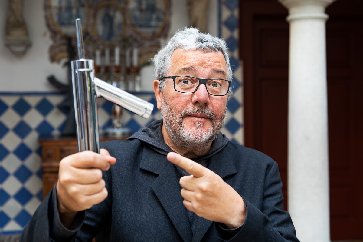 Philippe Starcke holding the tap designed for AXOR